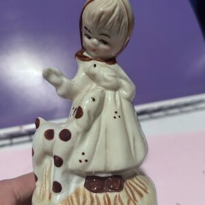Vintage musical figurine of a girl with a bird and dog- collectible from the 80s